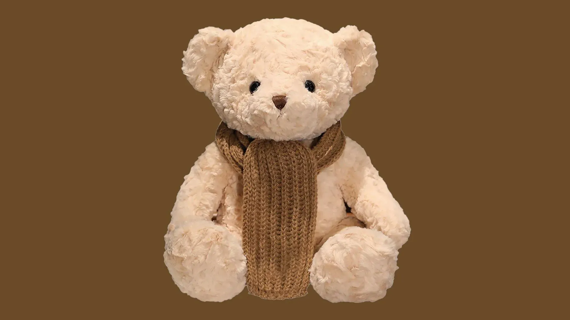 دب محشو يرتدي وشاحًا بنيًا، يمثل جزءًا من ألعاب الذكاء الاصطناعي التي تثير مخاوف بشأن المحتوى غير المناسب للأطفال.