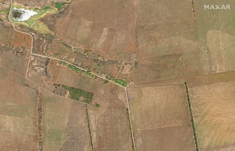 صورة جوية لمنطقة زابوريجيزيا في أوكرانيا، تظهر الأراضي الزراعية والمسارات، مرتبطة بالتحقيقات في انتهاكات حقوق الإنسان.
