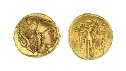 عملة ذهبية قديمة من مملكة مقدونيا، تعود إلى 336-323 قبل الميلاد، تظهر تفاصيل دقيقة لشخصية تاريخية.