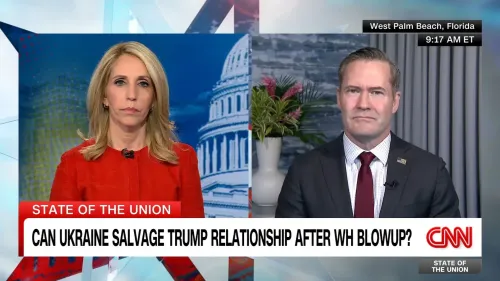 مقابلة على قناة CNN تظهر دانا باش مع ضيف يتحدث عن العلاقات الأوكرانية الأمريكية بعد اجتماع ترامب وزيلينسكي، مع خلفية لمبنى الكابيتول.