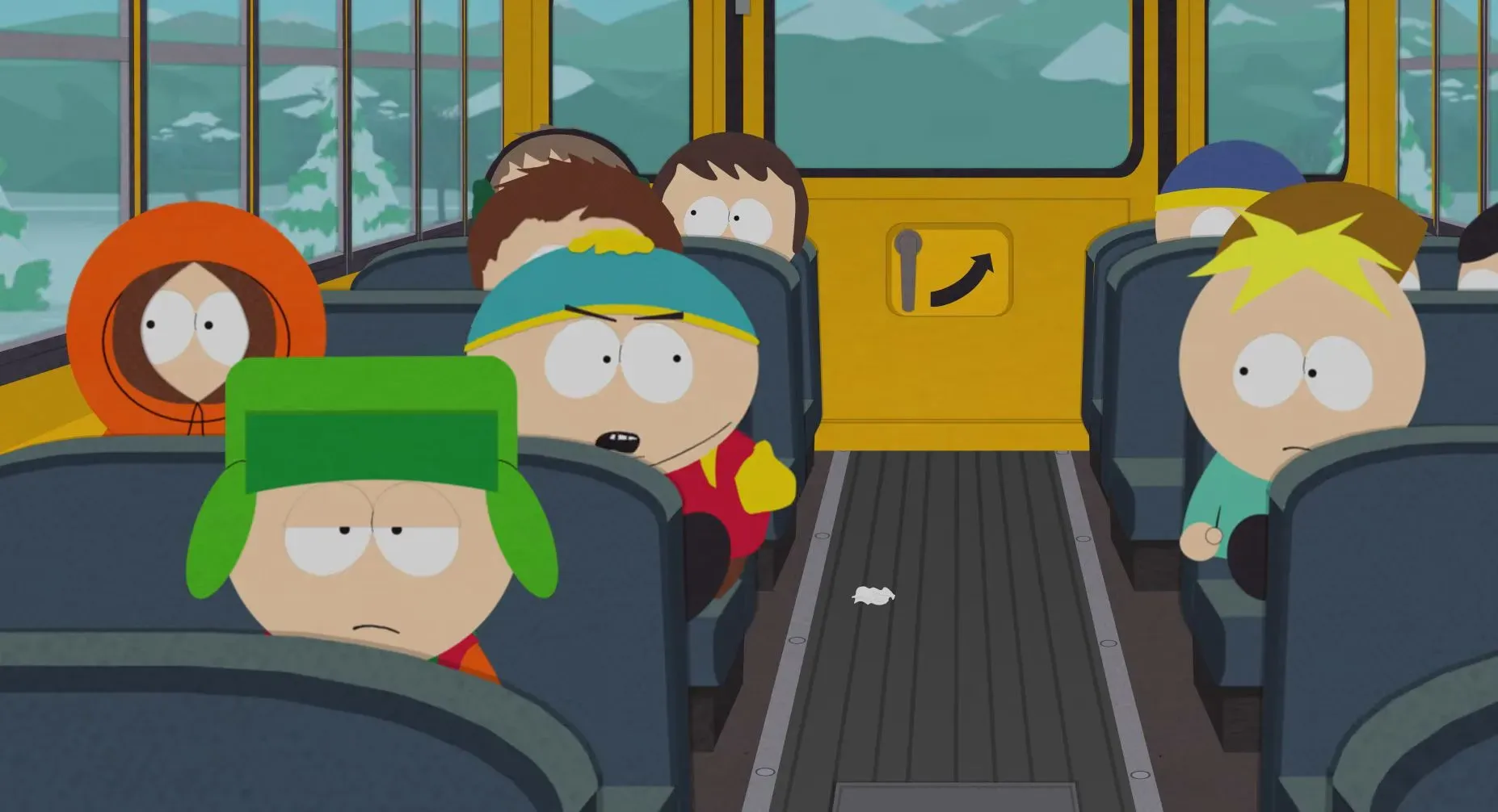 شخصيات من مسلسل "ساوث بارك" داخل حافلة مدرسية، تعكس أجواء السخرية والانتقادات الاجتماعية التي يتميز بها العرض.