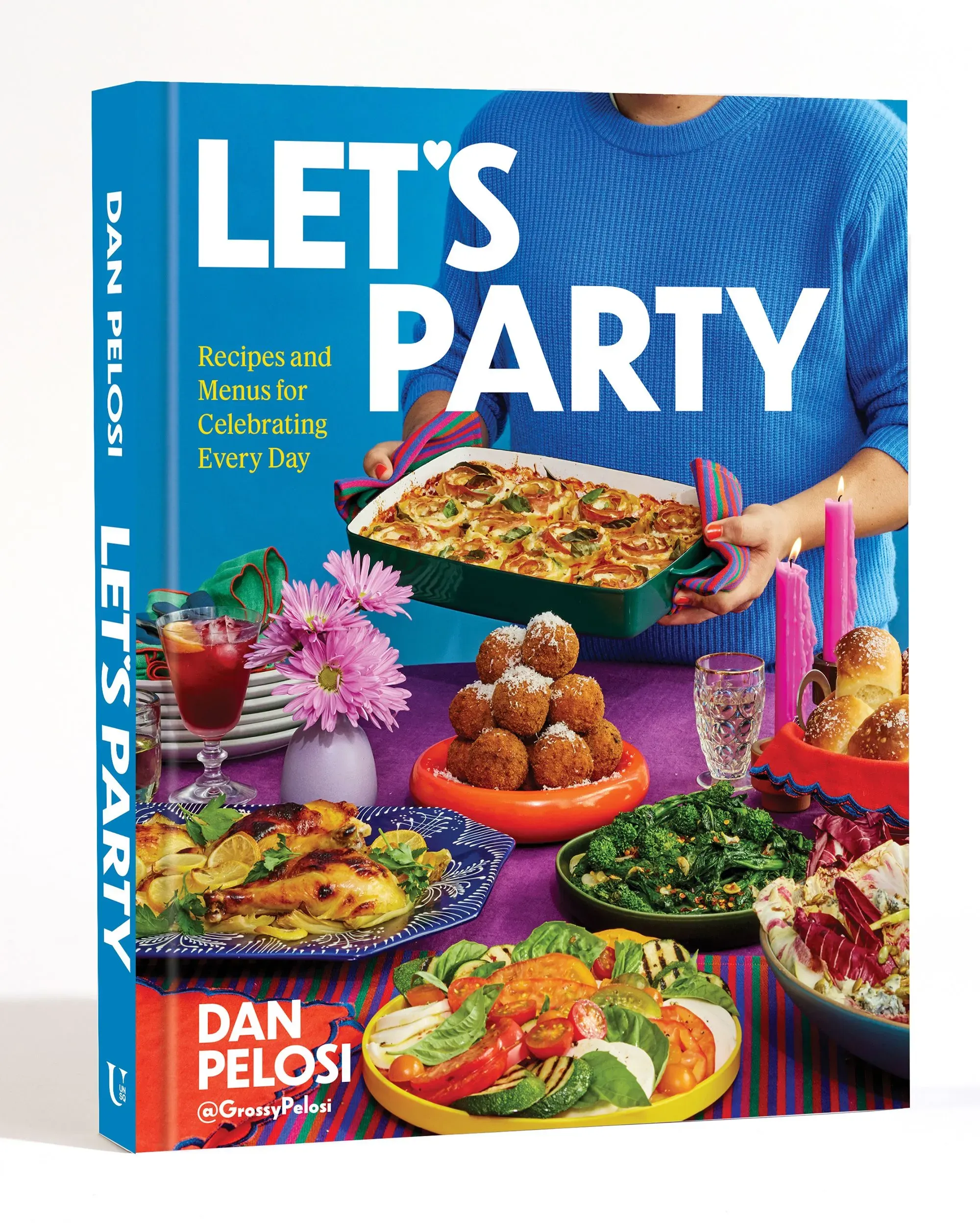 غلاف كتاب "لنحتفل" لدان بيلوسي، يعرض أطباق متنوعة ملونة وجذابة، مع تركيز على وصفات الحفلات غير التقليدية.